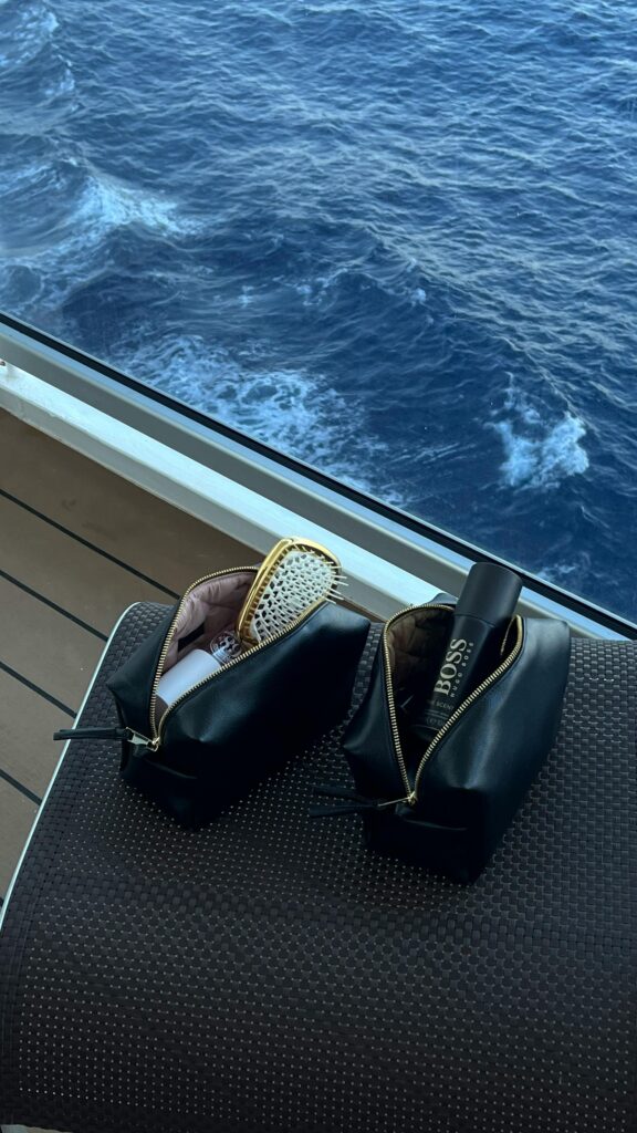 Luxury toiletries on a cruise ship deck with ocean view, capturing the essence of relaxation and travel.